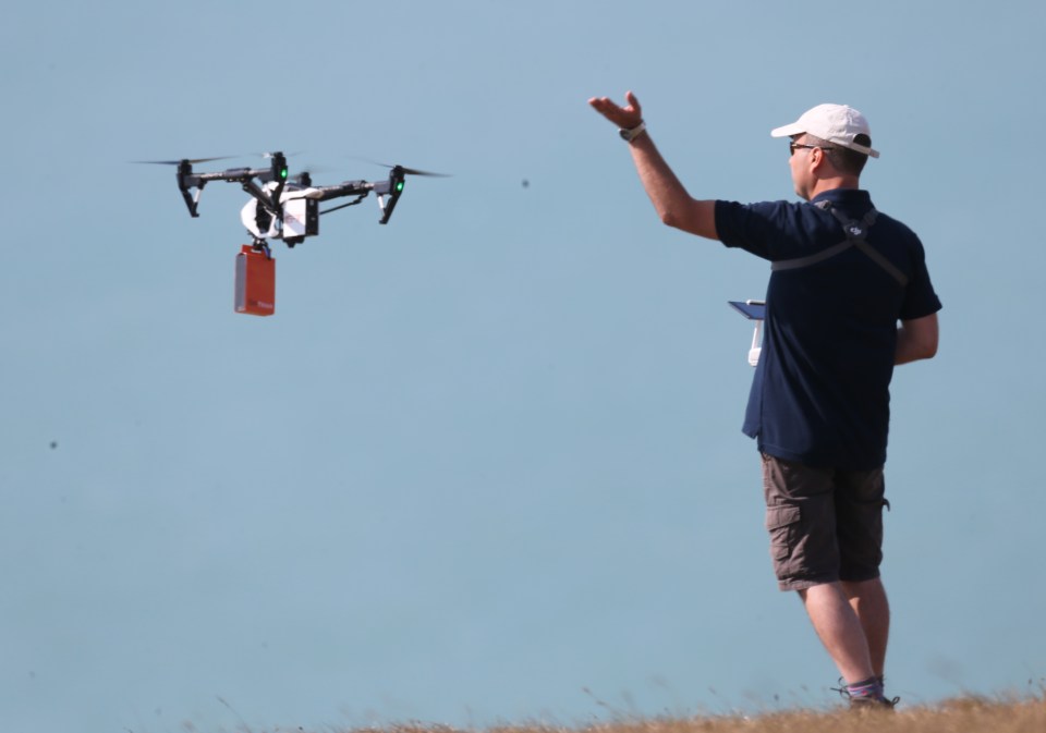 A crew member looked like he was in charge of flying the aircraft while filming in Beachy Head 