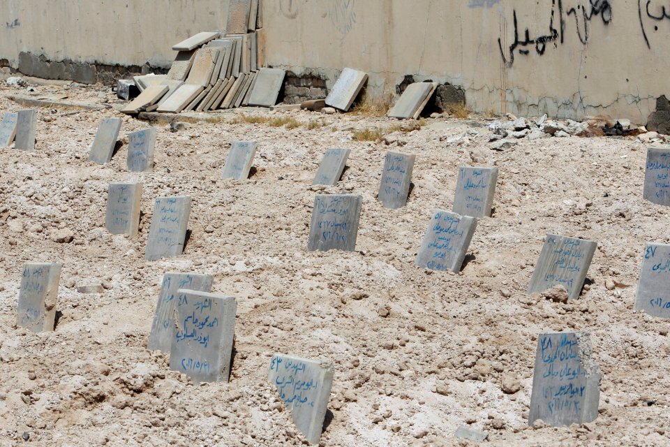 A mass grave for Islamic State militants are seen in Falluja