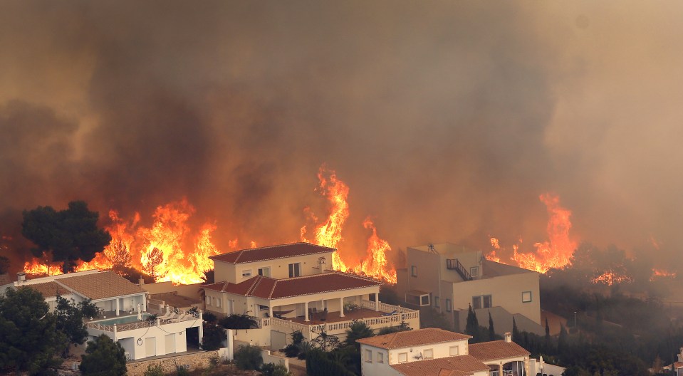The wildfire burns dangerously close to Benitachel village, 25miles east of Benidorm