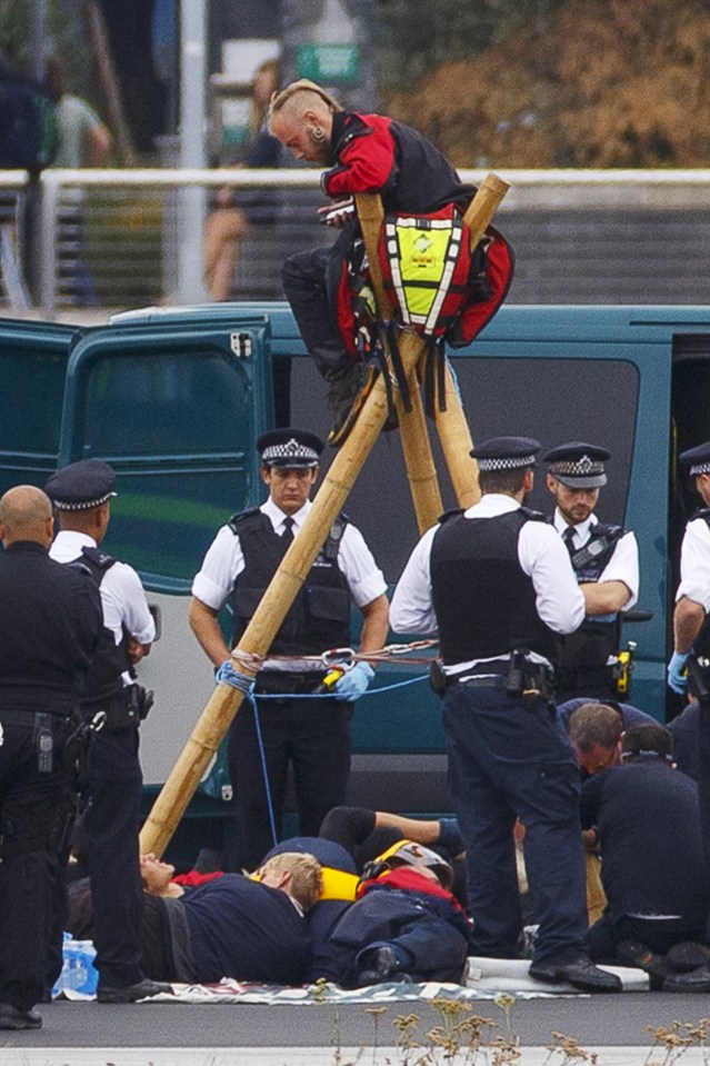 Nine 'activists' chained themselves to a tripod on the runway at London City Airport