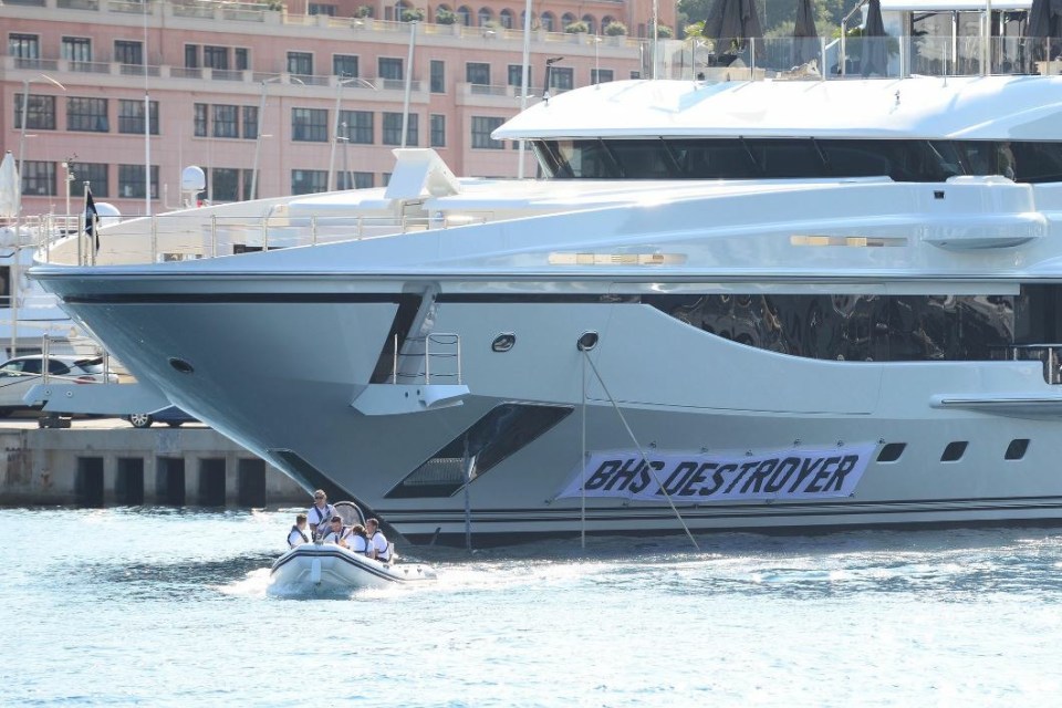 Comic Lee Nelson attached the sign to Sir Philip Green's yacht in Monaco