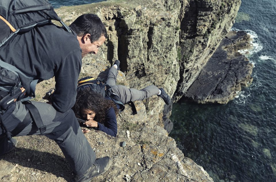 Mel was seen dangling from a cliff