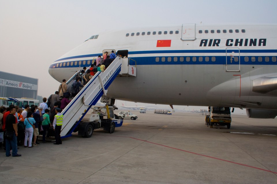 Passengers boarding an Air China plane