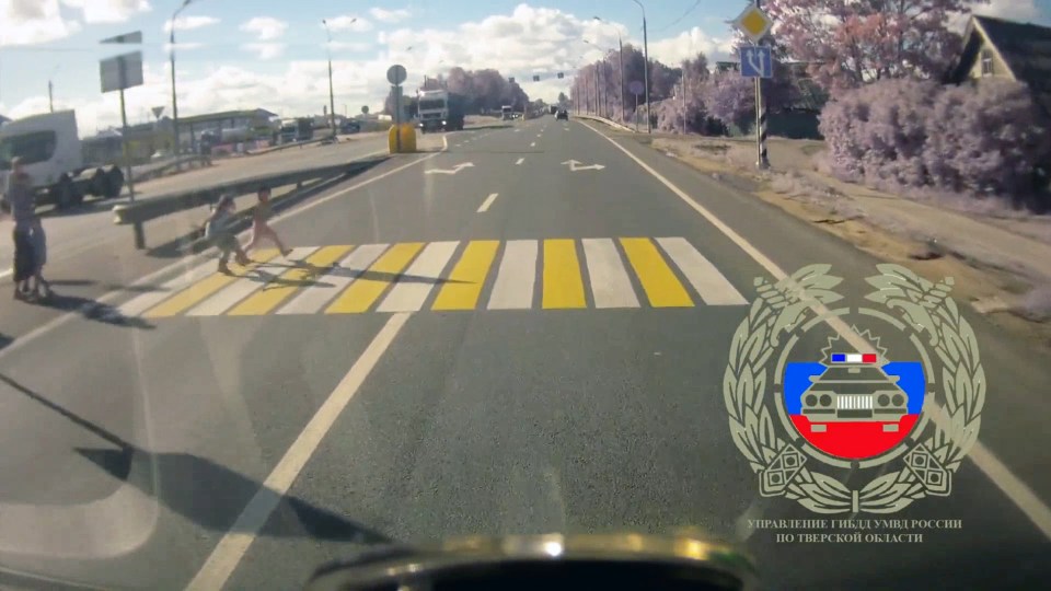 The girls step out on to the pedestrian crossing in Russia