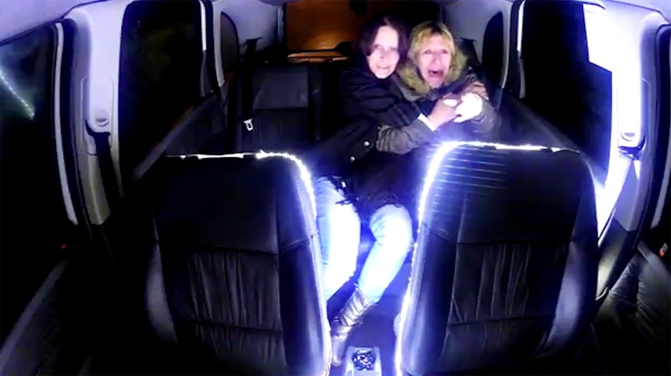 Two women scream in terror when they see the aliens emerge from the spacecraft