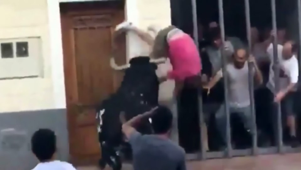 The bull lifted the man in the air with one his horns 