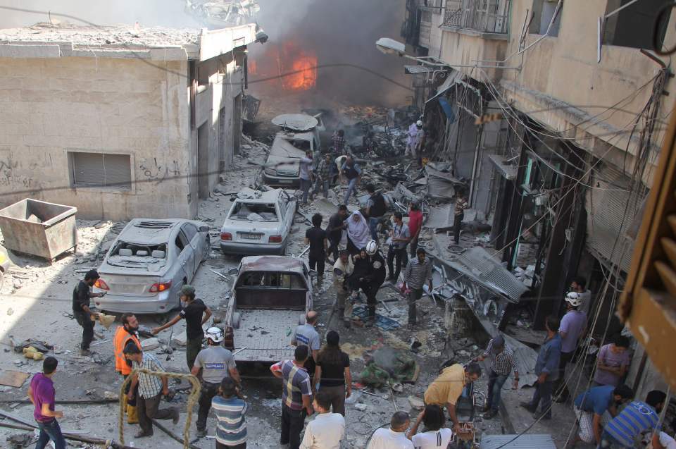 Syrians search for victims at the scene of the reported airstrike as hopes of a ceasefire grow