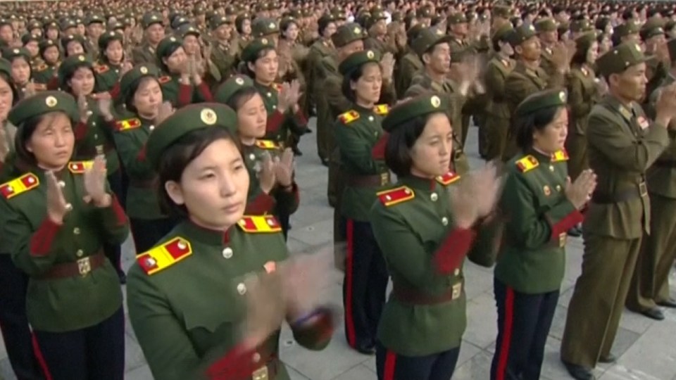 Female soldiers were also filmed clapping party leaders during the rally