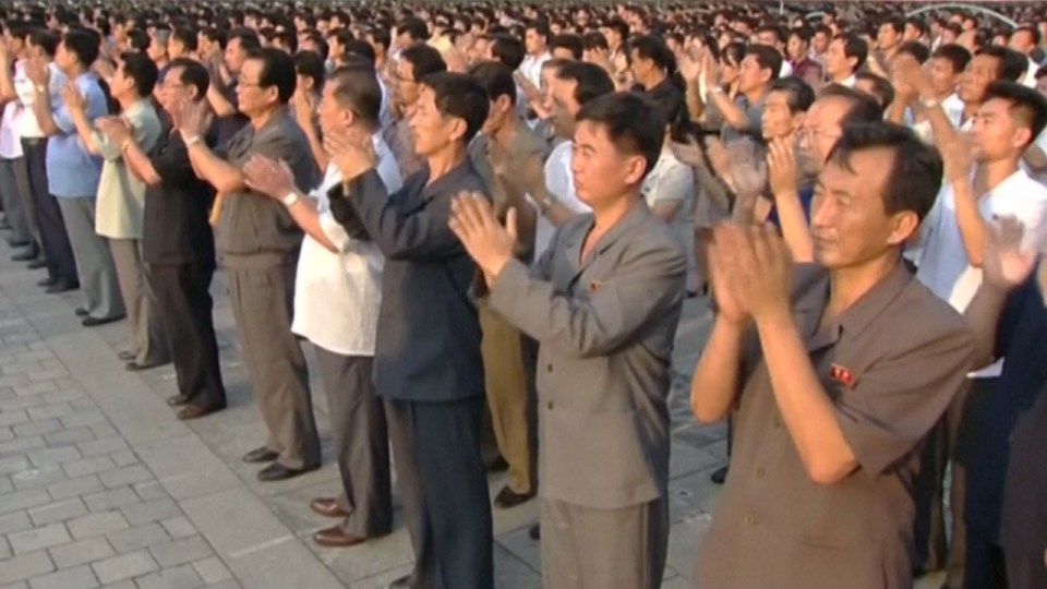 Footage showed citizens clapping along in eerie sychronization