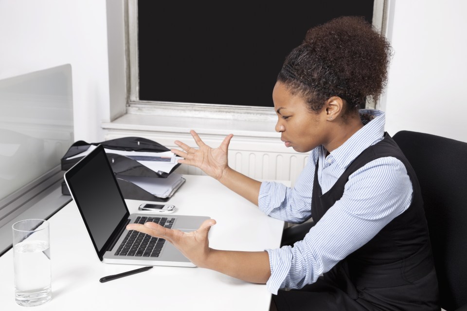 woman looking at laptop