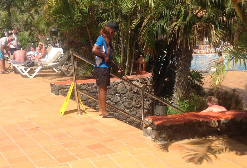 The staff member, from the resort's entertainment team, was trying to recruit tourists to go on a shooting activity
