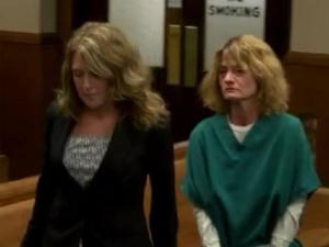 Rhonda Pasek is lead away after she appeared in court and was jailed