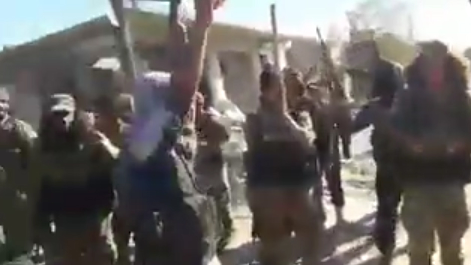 Rebel soldiers chant at the US Army