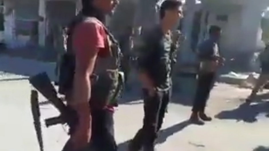 One of the rebels, not shown, squared up to a soldier