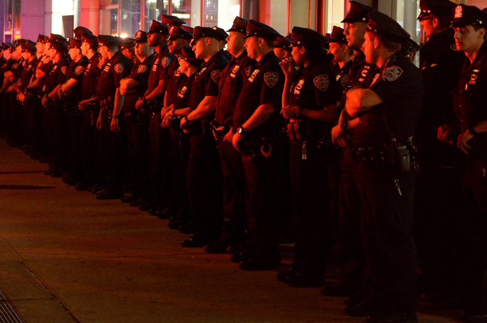 Police officers arrive to keep watch near the site of an explosion in New York