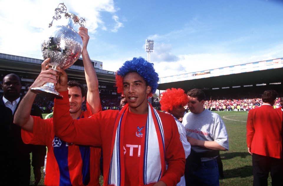 Chris Armstrong celebrating with the Championship trophy with Crystal Palace in 1994
