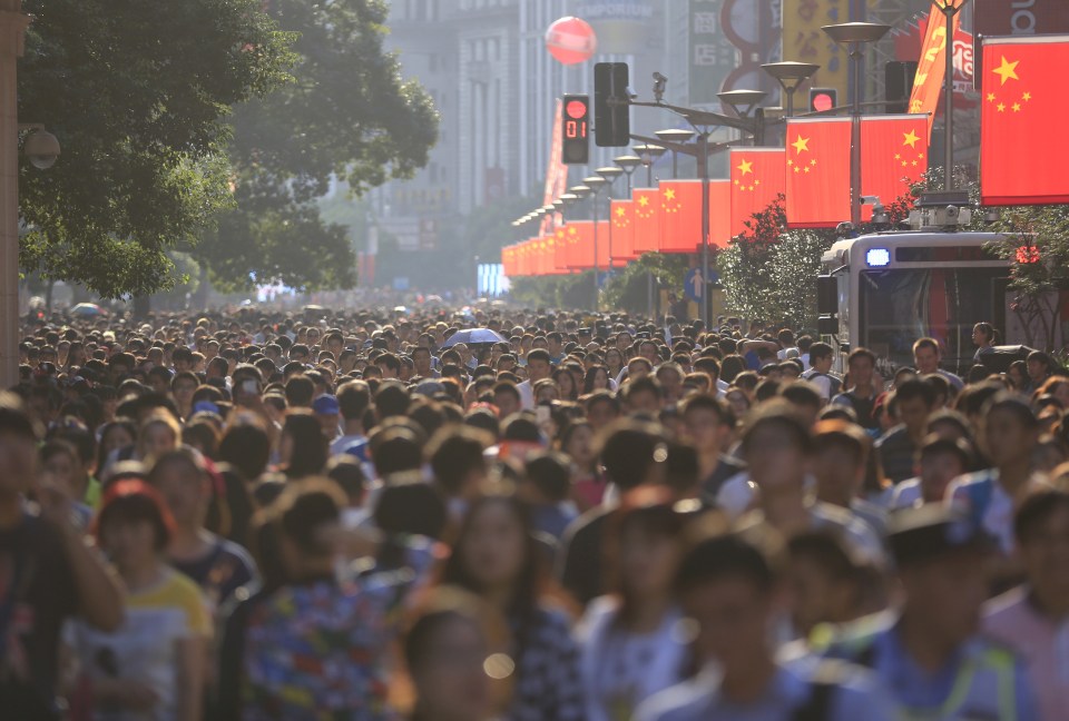 A shopping area in Shanghai is too crowded to navigate during a week-long national holiday 