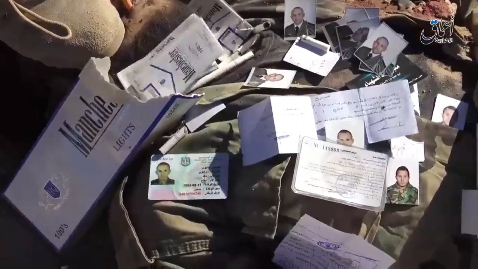 The ID cards of dead Syrian soldiers