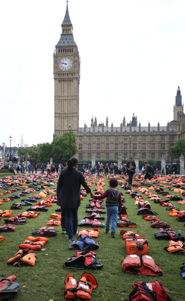 Parliament Square in London is transformed into a 'graveyard of lifejackets'