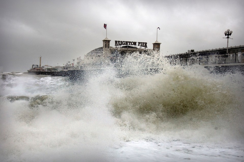 Get redy for more of this kind of weather this week - a giant wave batters the shoreline by Brighton pier 
