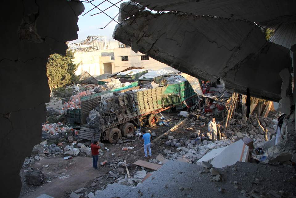 Aid is seen strewn across the floor in the town of Orum al-Kubra 