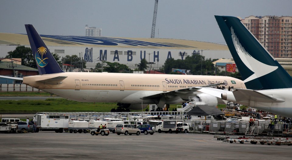 A Saudi Arabian Airlines passenger plane is pictured parked at the tarmac of Ninoy Aquino International airport in Pasay city, Metro Manila