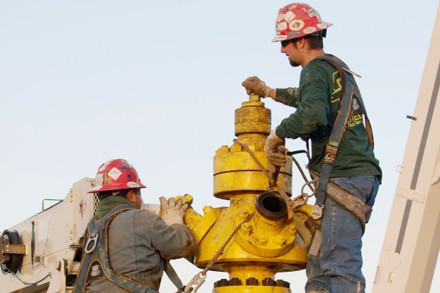 Well head getting connected to high pressure pipes for hydraulic fracturing. Fracking used since the 1950's. Image shot 2009. Exact date unknown.
