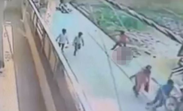 In the footage, a man grabs the victim and flings her to the ground before repeatedly stabbing and kicking her in the head
