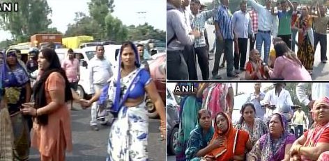 The relatives of the murdered girl form a human chain and protest with others at her death