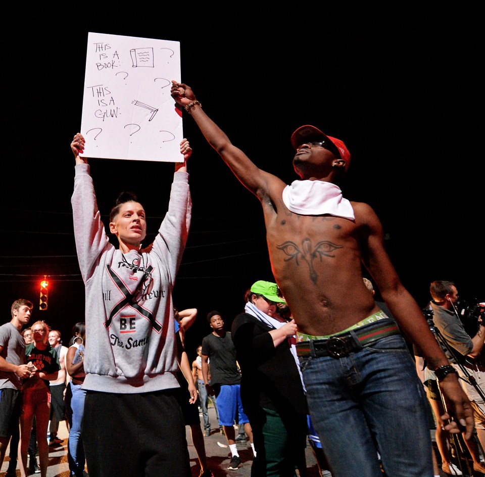 Protestors slammed the shooting with the man's family saying he had simply been sitting in a car reading
