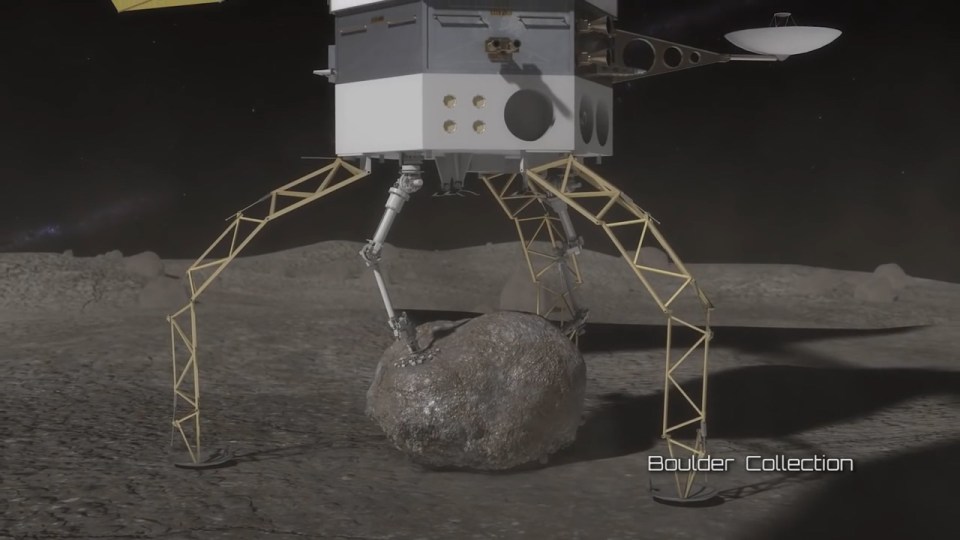 The vehicle will grab a boulder with its arms