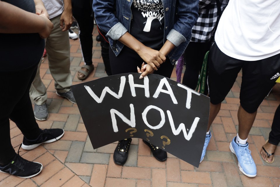 Students at the University of North Carolina Charlotte hold a vigil following Tuesday's police shooting of Keith Lamont Scott