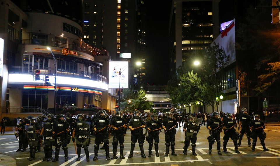 Police hold their lines in uptown Charlotte, NC during a protest of the police shooting of Keith Scott, in Charlotte
