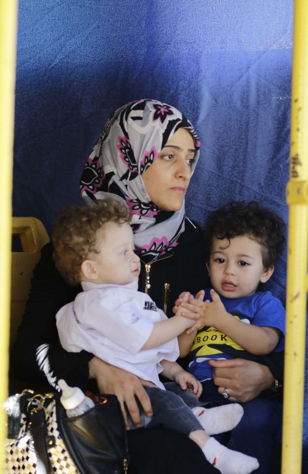 Families of opposition fighters board a