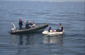 French coastguards rescue two migrants after they tried to cross the Channel in a DINGHY