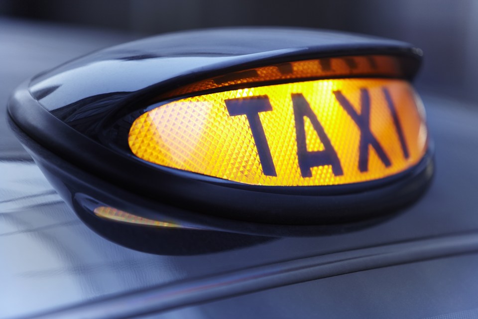 Close up of lit taxi sign