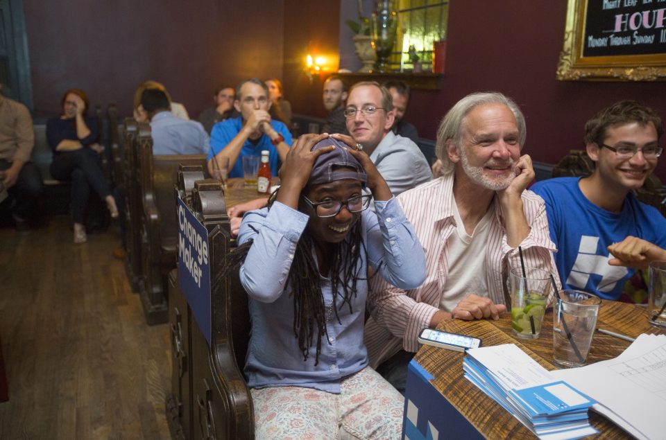 Potential voters watch the first presidential debate between Democratic nominee Hillary Clinton and Republican nominee Donald Trump at a bar in Philadelphia, Pennsylvania