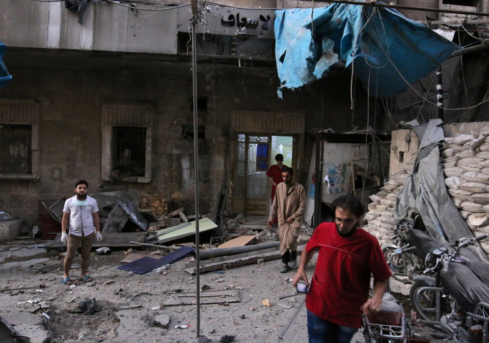 Medics inspect the damage outside a field hospital after an airstrike in the rebel-held al-Maadi neighbourhood of Aleppo
