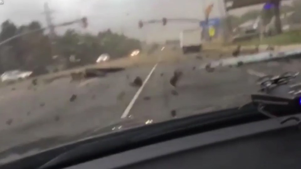 It left debris from houses and buildings scattered across the road