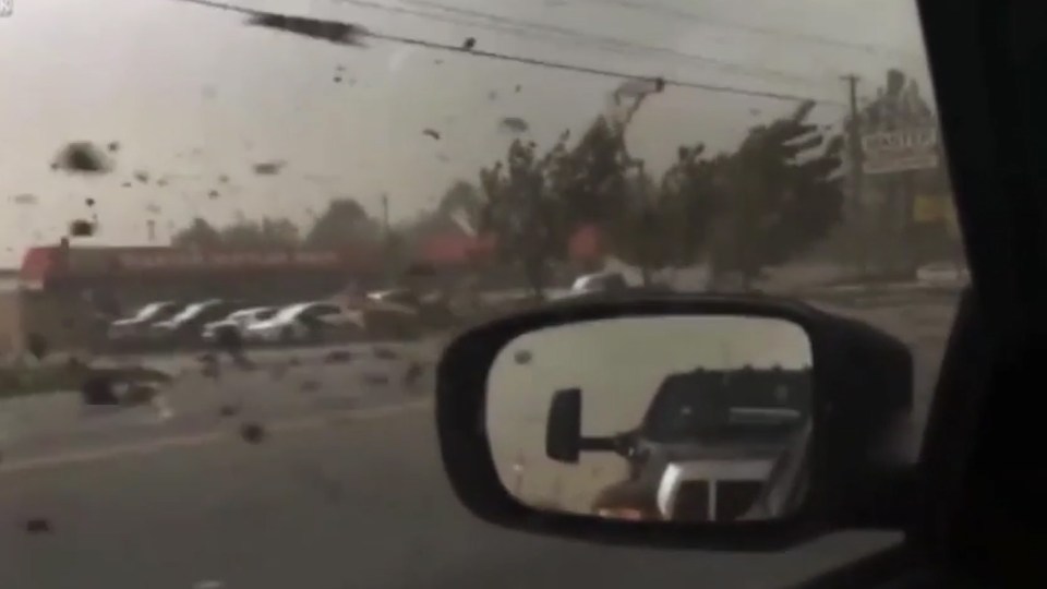 The terrifying footage shows a building being ripped apart by a tornado