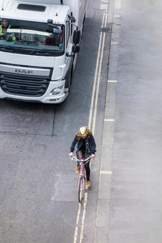 Cyclist riding close to the pavement