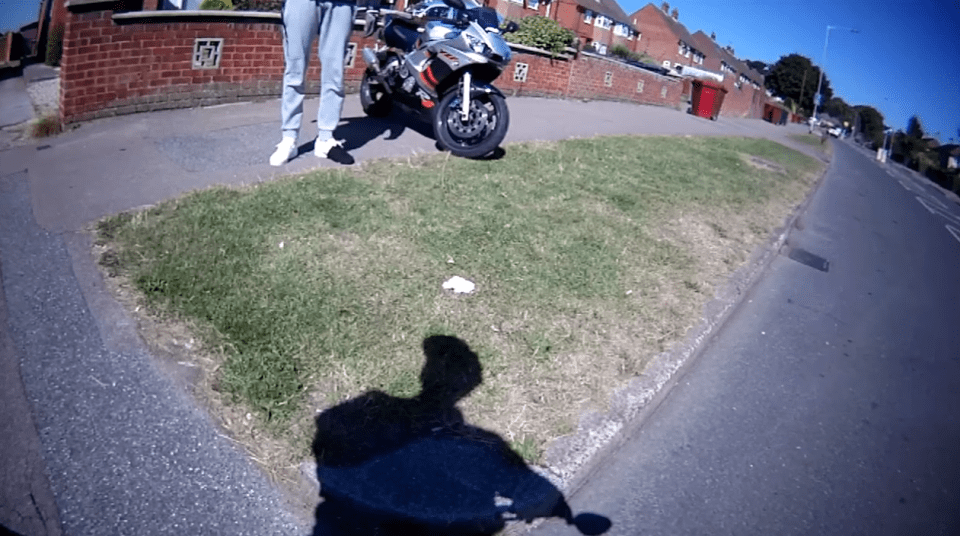 The motorbike rider gets off his bike to fight the cyclist, with police now investigating the incident