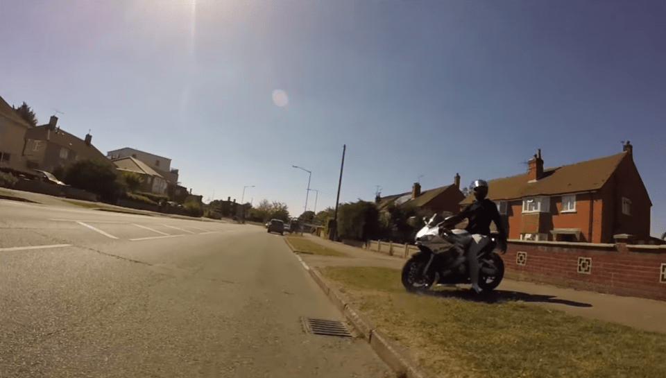 The motorbike rider eventually tells the cyclist to leave, standing menacingly at the side of the road as he cycles off
