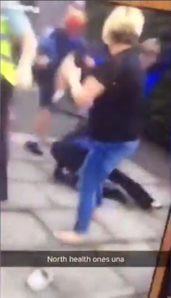 A woman attempts to intervene in the violence in south London