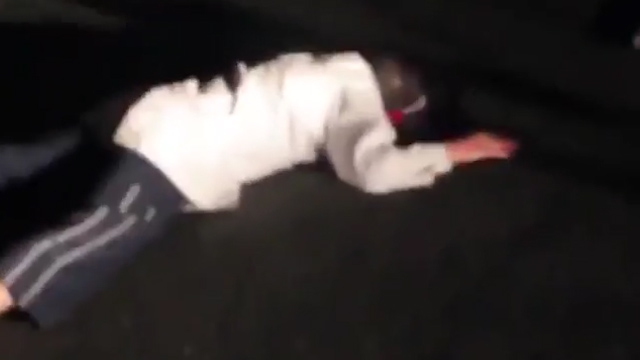 The clown is left face down after the apparent confrontation with men who were hunting the masked pranksters