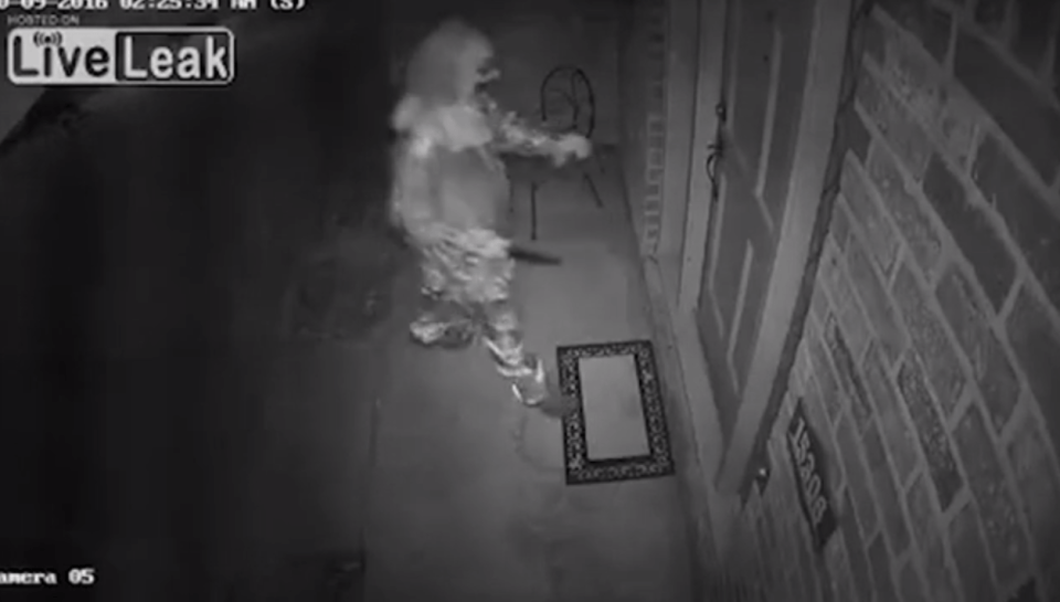 The clown appears to be calm as he approaches the home, with it unclear what would have happened if he had managed to get inside