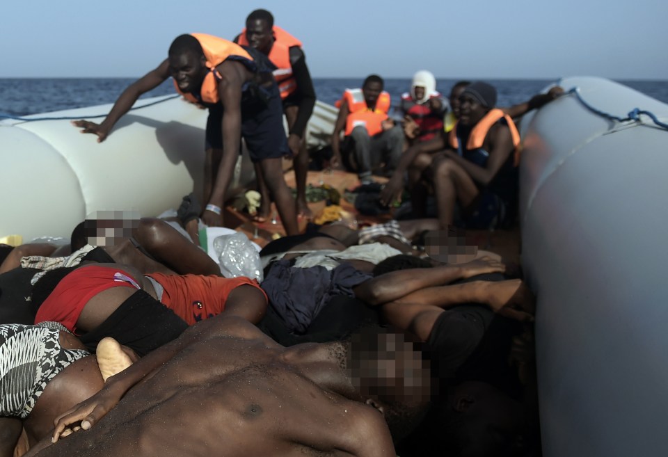 Harrowing images show migrants making their journey from Libya to Europe tip-toeing on bodies in a crammed vessel