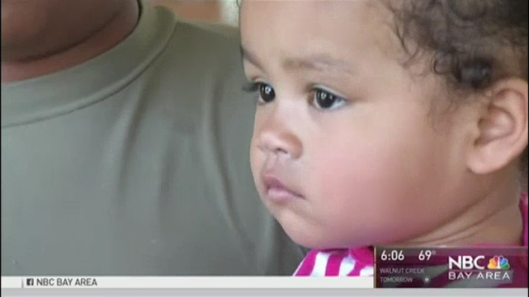 The clown tried to snatch her one year old little girl Kasani at the bus stop 