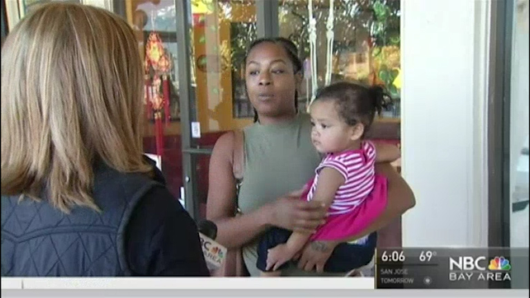 Tiffany Martin was waiting for a bus with her little girl Kasani when the creepy man in a blue wig and a rainbow and polka dot clown suit started chatting to the tot