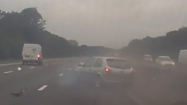 Smoke can be seen coming from the car's bonnet as it grinds to a halt on the motorway